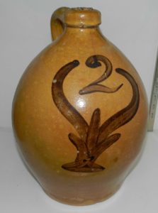 Whitewater earthenware two-gallon jug with lead glazed with manganese "ice tongs" flower decoration. Attributed to the Depot Pottery. Private collection.