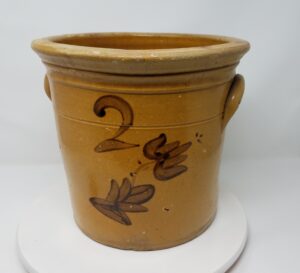 Whitewater two-gallon crock with ear handles, manganese decoration and a single inscribed line. Note the prominent and highly shaped rim that is typical for Whitewater crocks and cream pots. Private collection.
