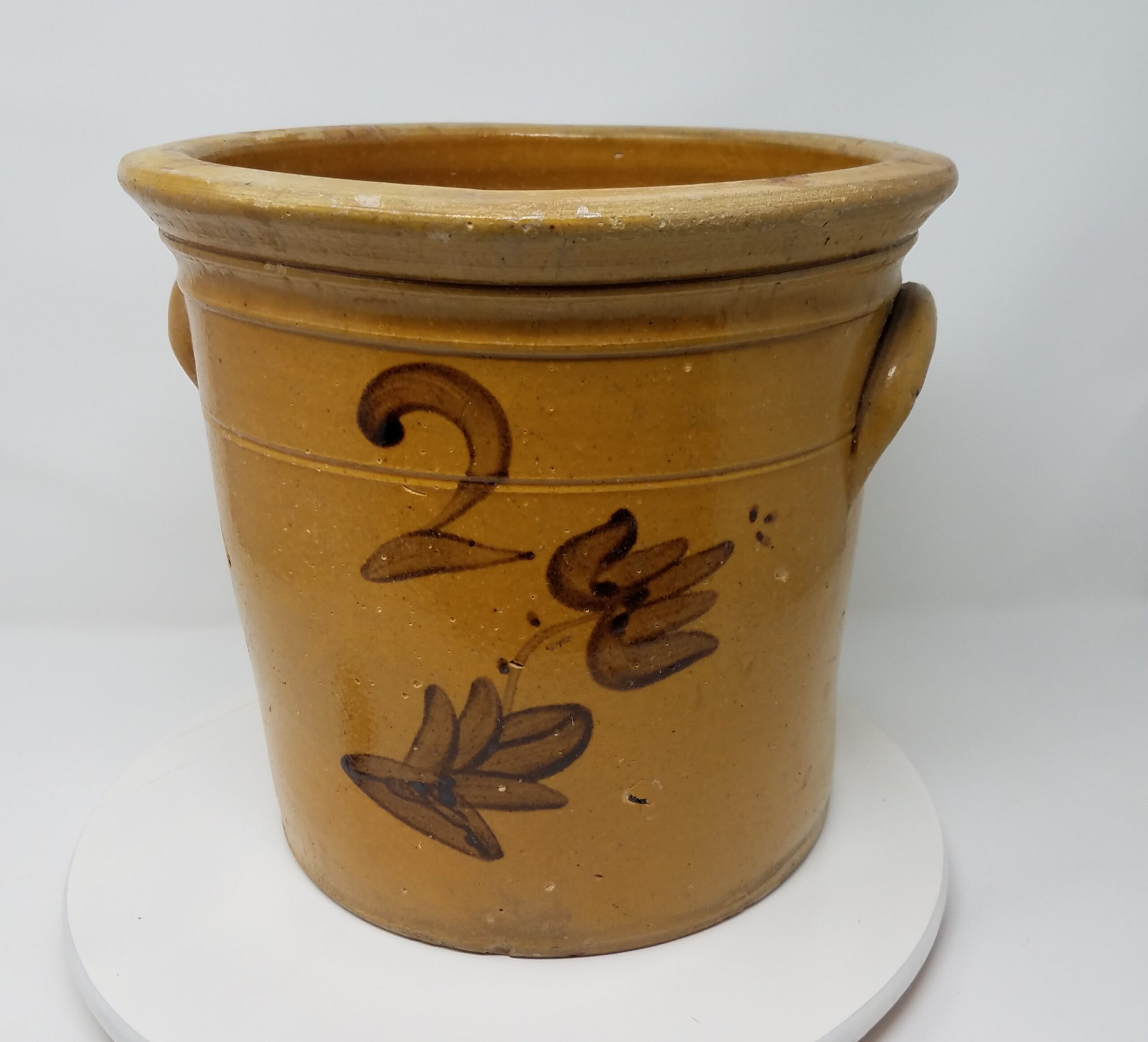 Whitewater two-gallon crock with ear handles, manganese decoration and a single inscribed line. Note the prominent and highly shaped rim that is typical for Whitewater crocks and cream pots.
