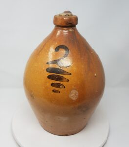 Whitewater two-gallon ovoid jug with hand painted "2" with underlines in manganese. Private collection.