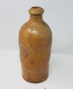Whitewater bottle with lead glaze.  The design of the bottle suggests that is was used for something other than soda or beer - it could be for any liquid. It is not stamped. Private collection.