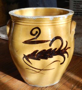 Whitewater two-gallon cream pot with ear handles and clear lead glaze. Painter "2" over a large fern with a scroll below. Private collection.