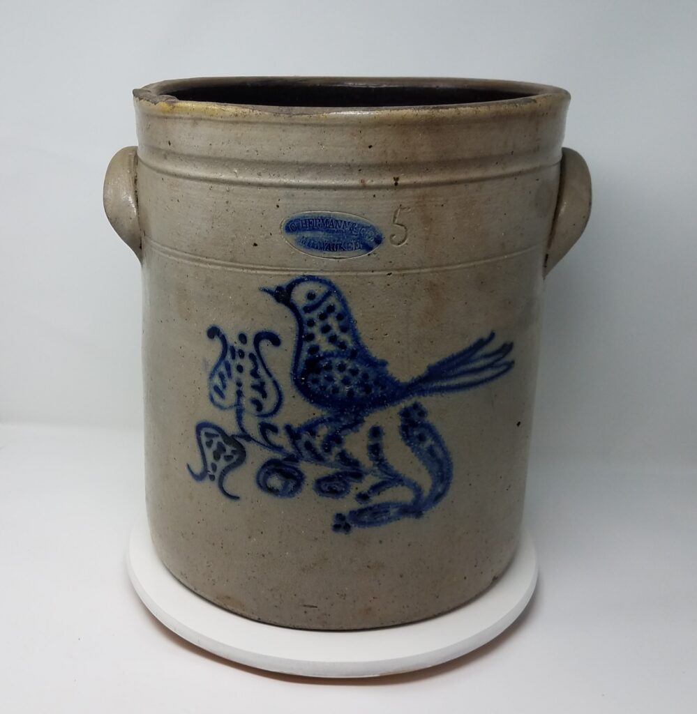 Cobalt decorated salt glaze crock with bird on a flower. All of the Hermann bird stoneware appears to have been decorated by the same person using a slip cup and dots during the 1850's and 1860's.