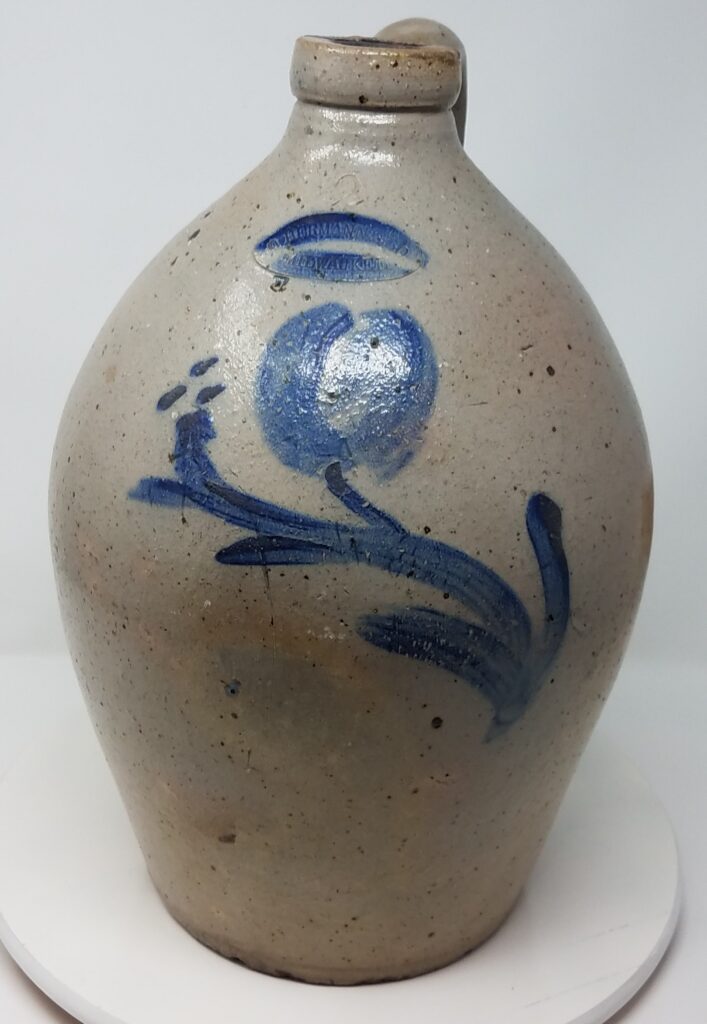 Cobalt decorated, salt-glazed jug with simple brush rendered floral decoration.