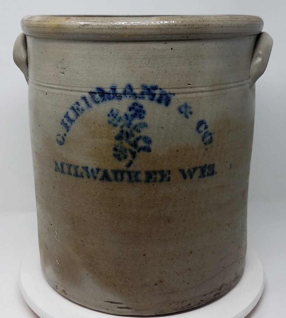 Cobalt stenciled, salt glazed crock. made for a Milwaukee Merchant by Ch. Hermann & Co. This is a transition piece from hand decoration to more efficient marking.  Probably dates to the early 1870's. It is not stamped.