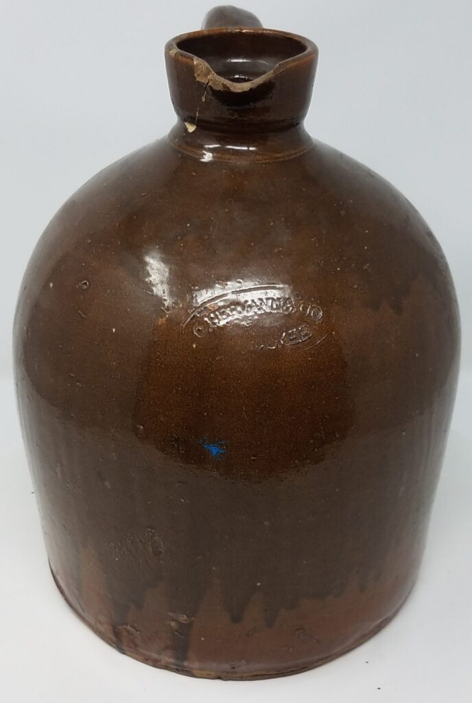 Albany slip jug with pouring spout for molasses, syrups, or other viscous liquids. Jugs with pouring spouts are rare.
