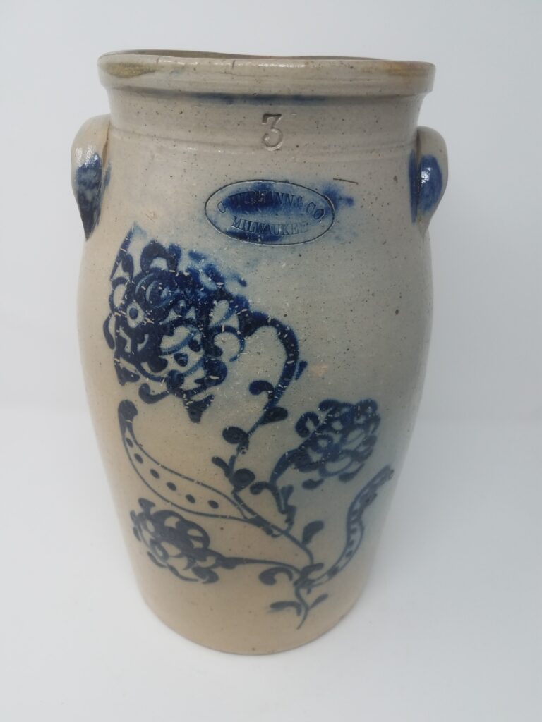 Butter churn with elaborated slip cup and brush cobalt decoration and accents on the ears. Capacity "3" is incised.