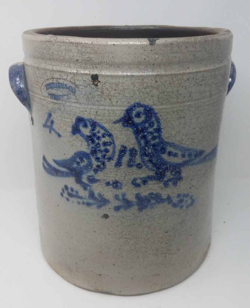 Cobalt decorated salt-glazed butter crock decorated in cobalt with two birds on a flower. All of the Hermann bird stoneware appears to have been decorated by the same person using a slip cup and dots during the 1850's and 1860's.