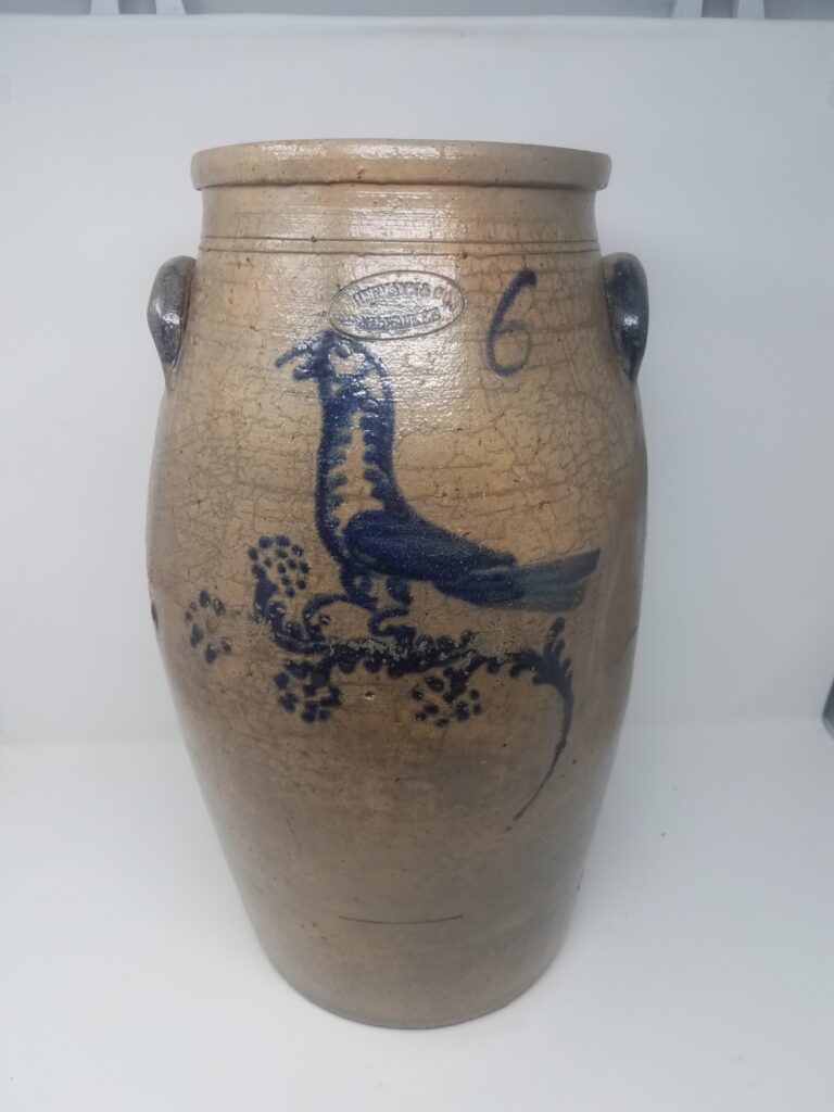 Cobalt decorated salt-glazed butter churn decorated in cobalt with a bird on a flower. All of the Hermann bird stoneware appears to have been decorated by the same person using a slip cup and dots during the 1850's and 1860's.