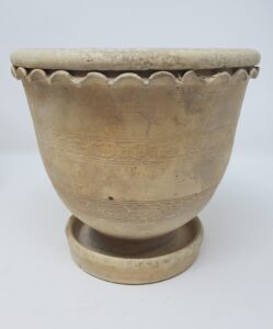 Unglazed Whitewater flowerpot with attached underplate. It has two decorative bands of incised decoration around the body. From the collection of the Whitewater Historical Society.