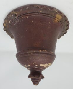 Unglazed hanging flowerpot with old paint. They were sold unpainted but some customers chose to paint them. From the collection of the Whitewater Historical Society.