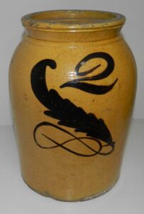 Whitewater food storage jar with a well-formed and tooled rim with an inner shelf for a lid. The manganese fern and capacity are exceptionally well done. Private collection.