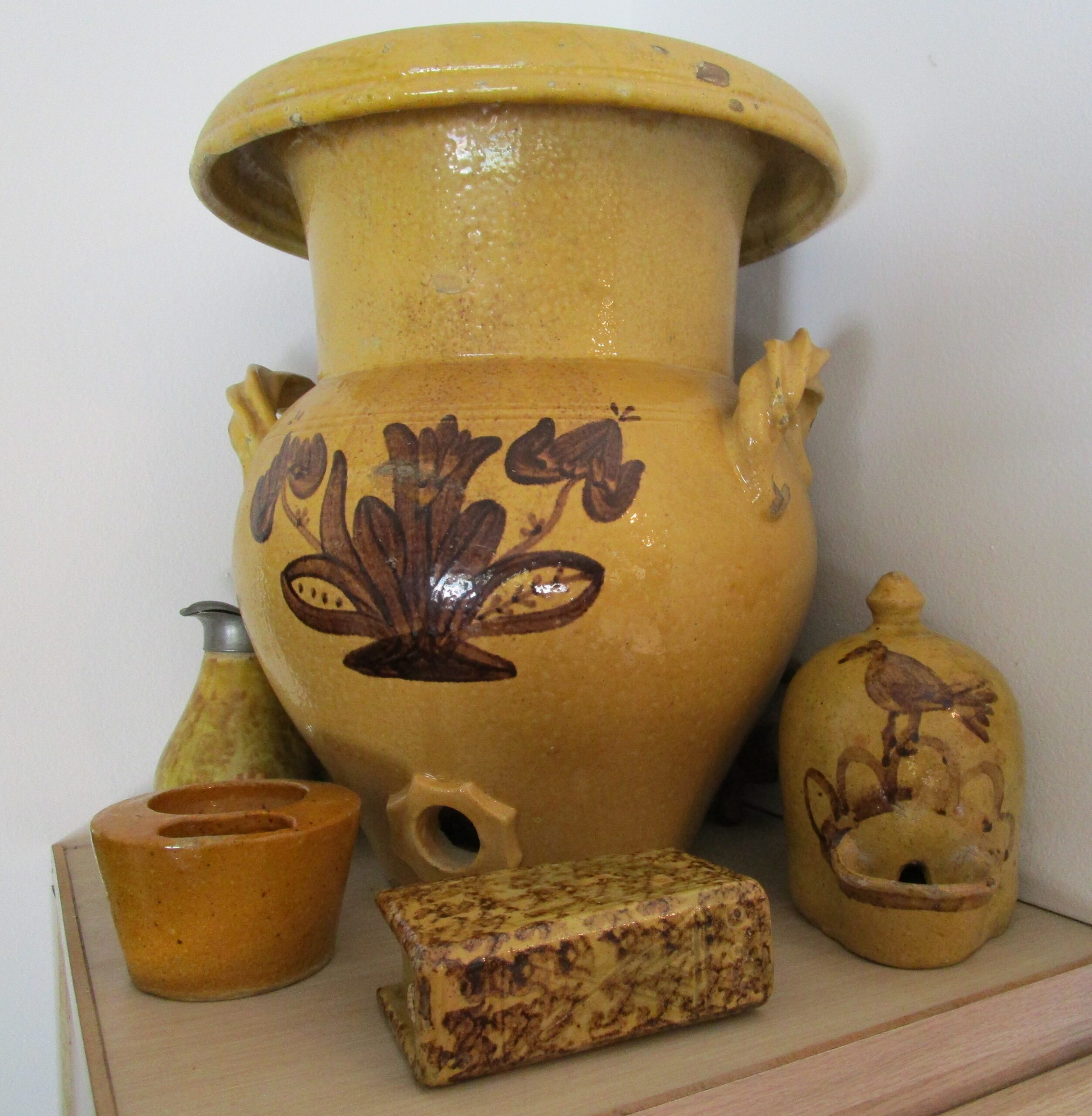 Water cooler, bird waterer, shaving mug, syrup pitcher, and book bottle. These pieces were originally collected in the 1940's by Whitewater resident Joseph Thiele. Private collection.