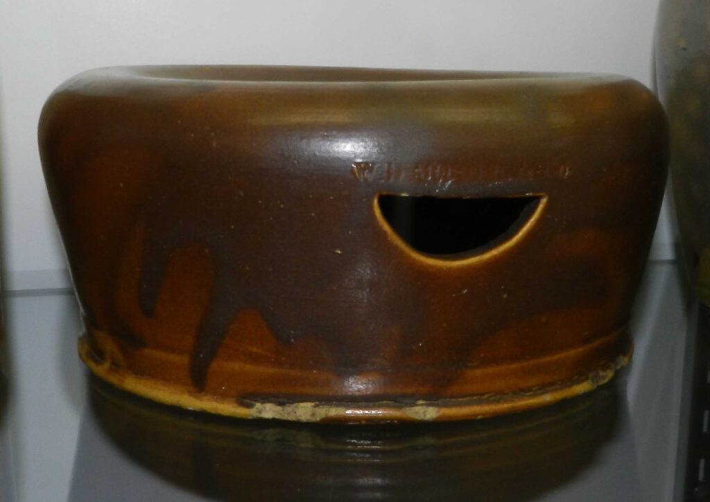 Earthenware spittoon with a brown lead glaze and stamped "W.D. MOSIER & CO." above the drain hole Mosier is the only pottery we are aware of with signed examples of this form, and there are two of them!